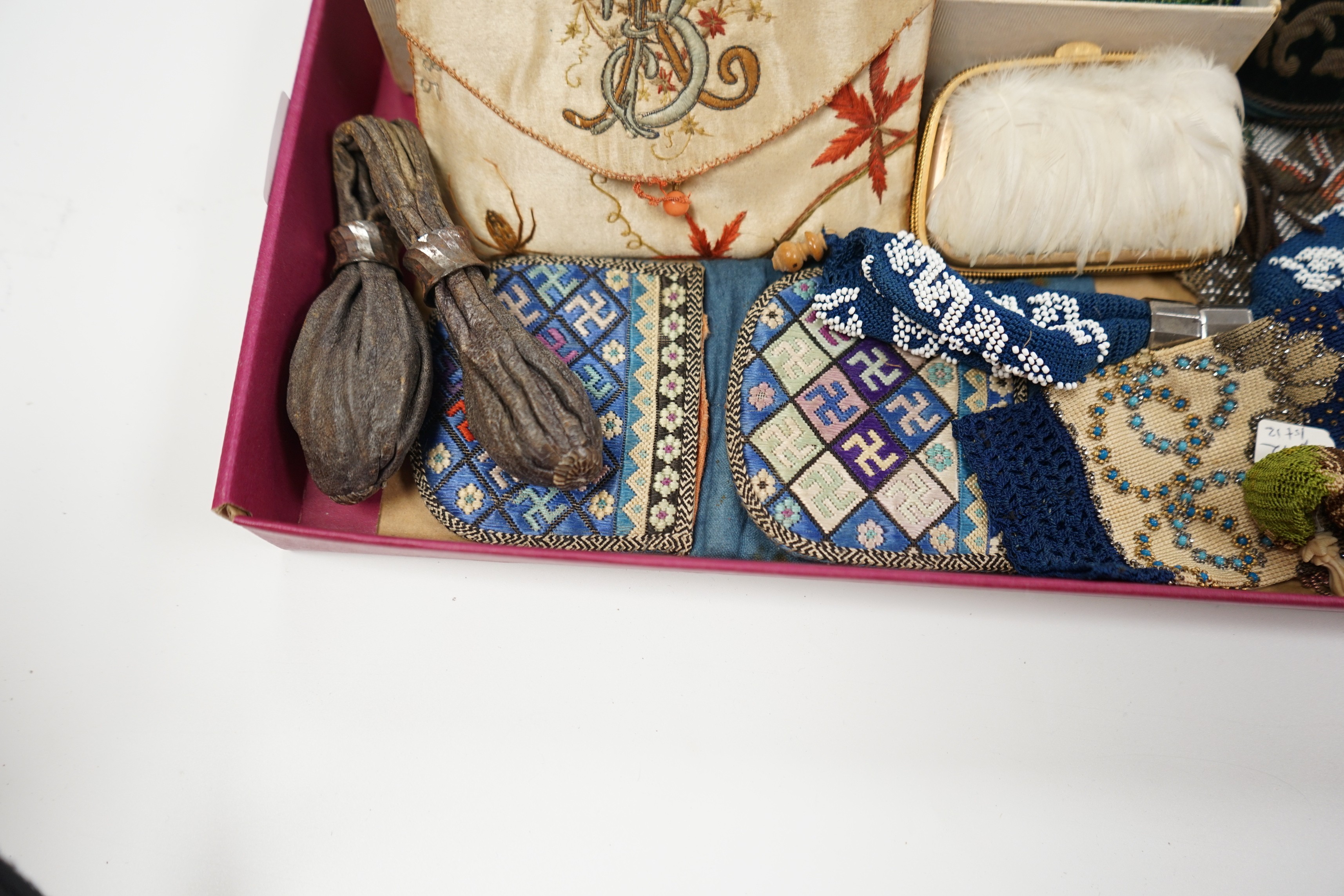 A velvet and metal embroidered reticule possibly 18th century, together with a collection of beaded embroidered knitted and leather purses, bags misers purses and a feather coin purse(14)